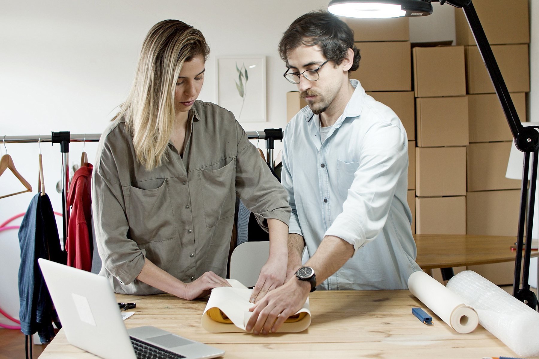 Ecommerce team collaborating around product preparation and customer orders